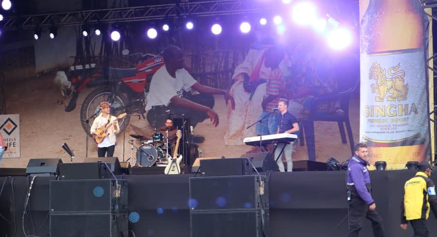 Miami Beat on the outdoor stage at MotoGP, Silverstone, under a bank of stage lights